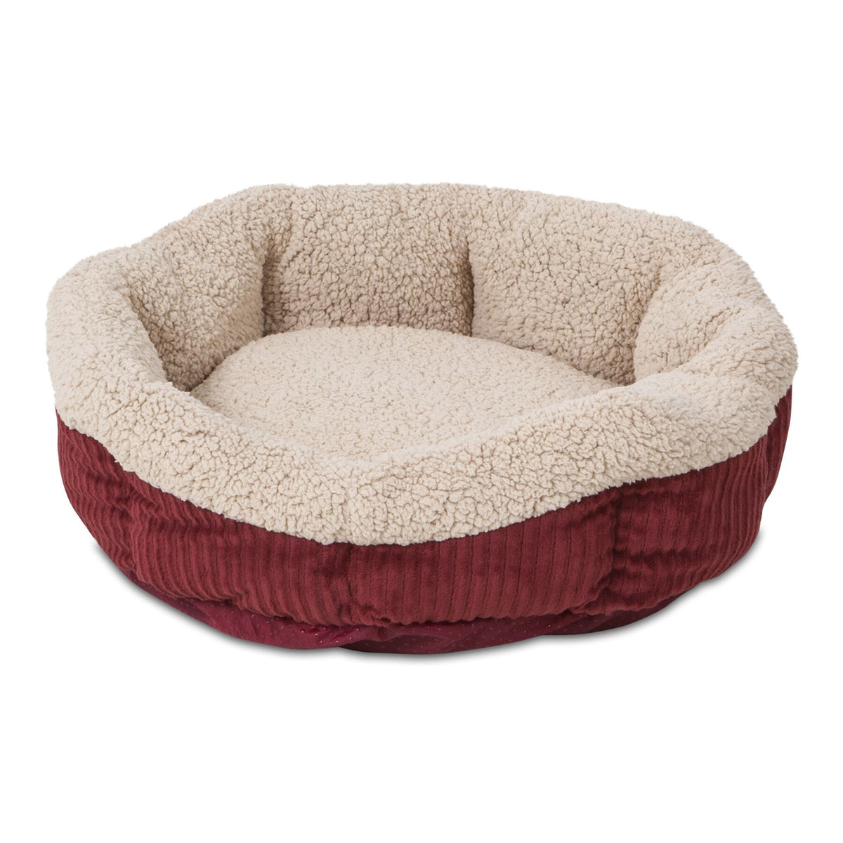 The Aspen Pet Self-Warming Oval Lounger Pet Bed offers a cozy design with deep red ribbed fabric and a plush cream faux lambswool interior. Raised sides provide comfort and security, while the non-skid bottom ensures stability for small to medium-sized pets seeking warmth.